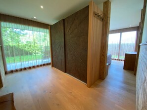 A spacious room with large windows, a wooden floor, and a modern design. - Eden 3 by Arosa Holiday Appartement/Fewo, Bad, WC, 6-Bettwohnung by Interhome (Arosa)