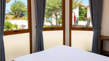 Bungalow, Garden View | In-room safe, desk, laptop workspace, blackout drapes