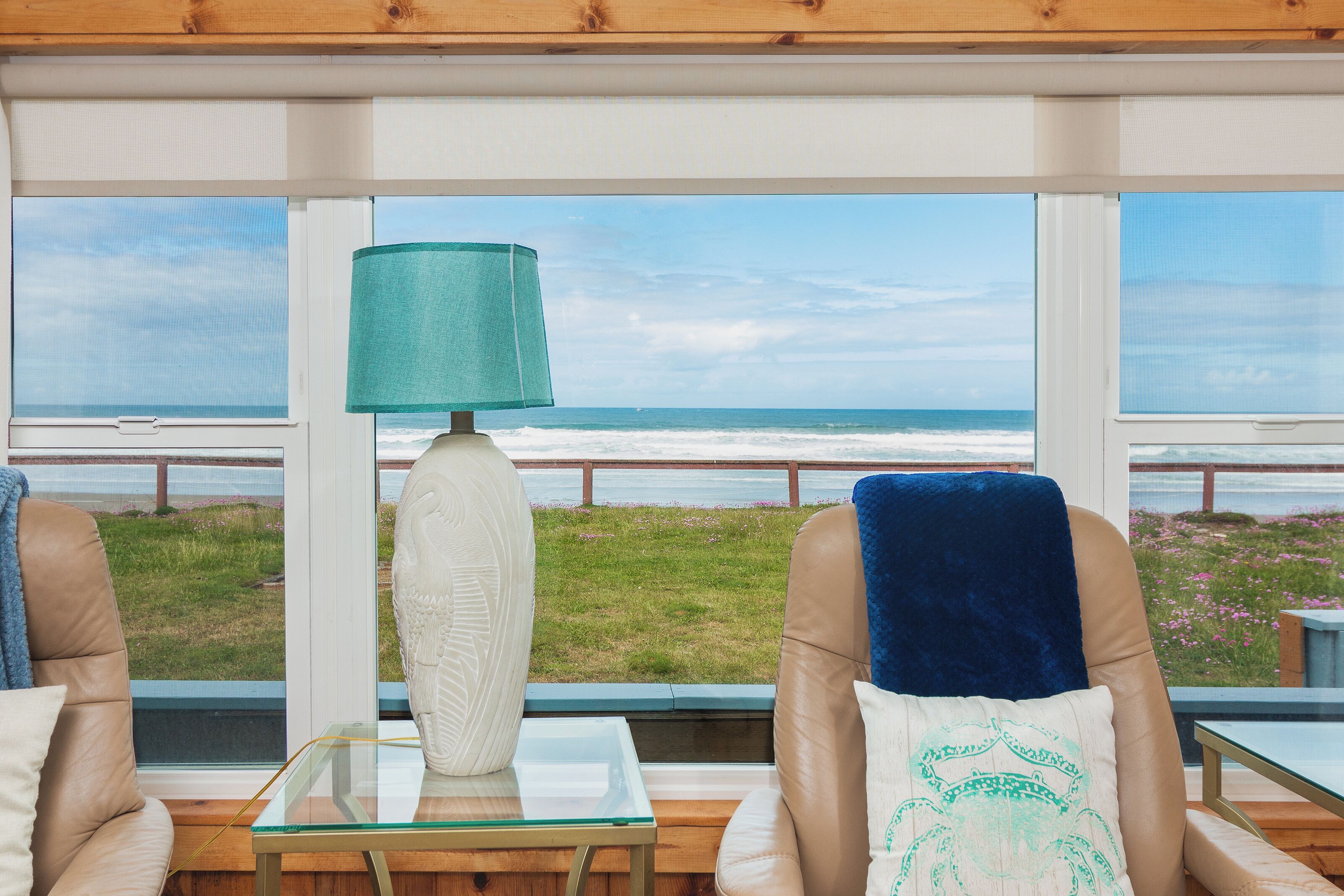 Settle into your cozy living room and drink in the stunning sea views framed by floor-to-ceiling windows, where turquoise waters meet endless sky.