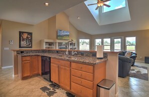 A spacious kitchen with a central island, built-in appliances, and a view to the outdoors. - New Listing! Golf Course & Mtn Views | A/C | Spacious Townhome (Pagosa Springs)