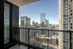 A high-rise building with a view of a cityscape. - The Azure Rise | 2B1B Condo in Downtown MTL (Montreal)