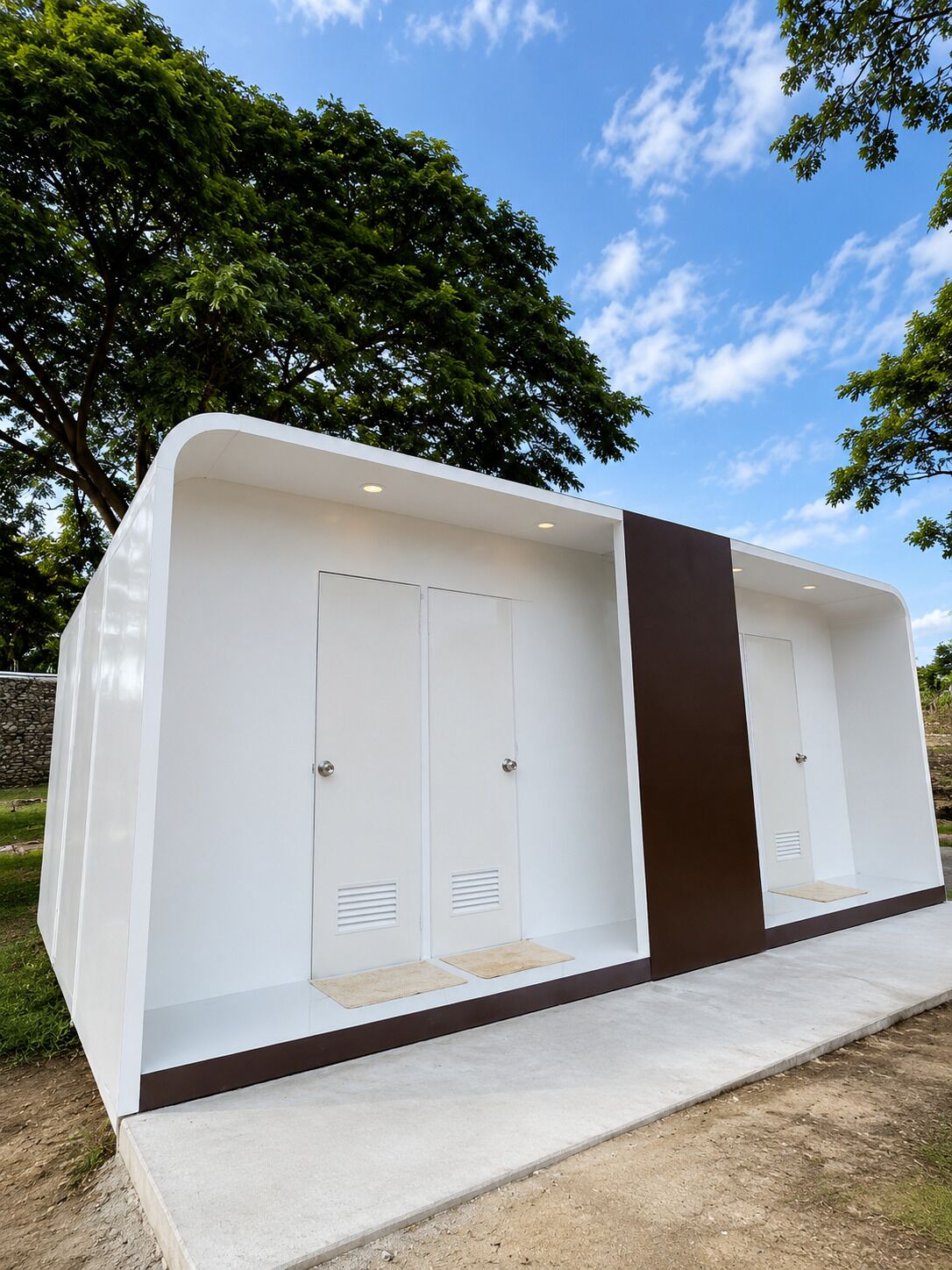 A modern, white, single-room structure with a dark brown accent wall, a door, and a small window.