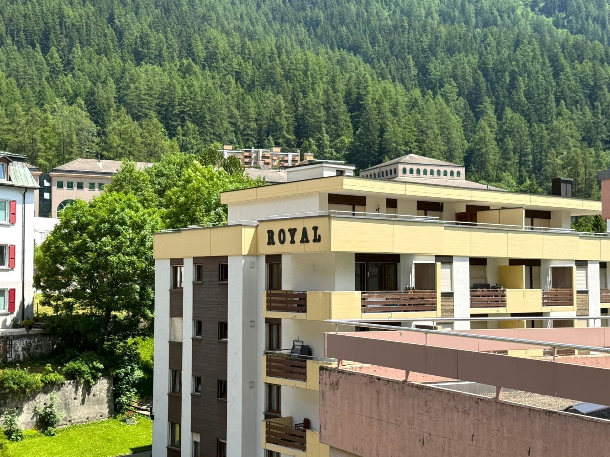 A multi-story hotel with balconies and a 'ROYAL' sign.