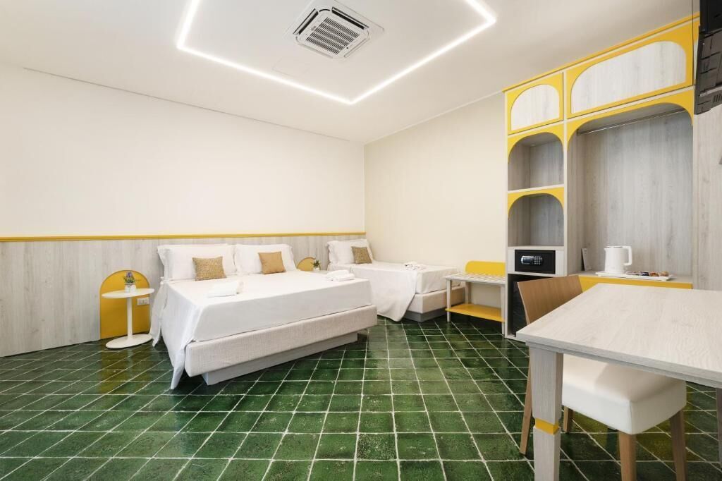 Triple Room, Courtyard View | In-room safe, desk, laptop workspace, soundproofing