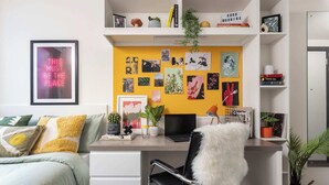 A modern bedroom with a bed, desk, and shelves. - Student Only Brass Founders (Sheffield)