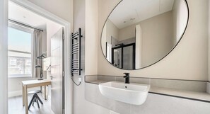 Shower, hair dryer, towels, shampoo