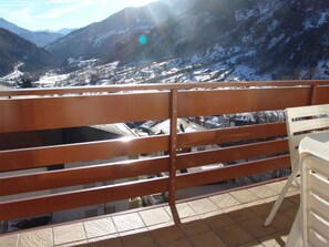 A balcony with a view of a snowy mountain landscape. - Clabina 19 # 4-bed apartment, Bad, WC 4-Bettwohnung, Bad, WC by Interhome (Leukerbad)