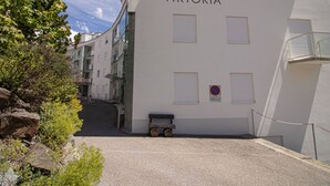 A building named 'VIKTORIA' with a no parking sign, a small cart, and a gated entrance. - Viktoria B16 by Arosa Holiday Appartement/Fewo, Dusche oder Bad, WC, 4-Bettwohnu by Interhome (Arosa)