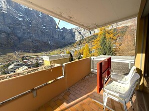 A balcony with a view of mountains and a town. - Lärchenwald 1808 # 4-bed apartment, Bad, WC 4-Bettwohnung, Bad, WC by Interhome (Leukerbad)