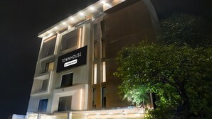 A multi-story building with a sign reading 'TOWNHOUSE' and 'Company-Serviced.' - Premium Townhouse Majra Isbt Dehradun (Dehradun)