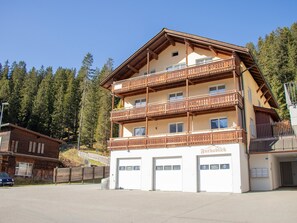A multi-story building with balconies, a garage, and a sign indicating it is a 'Turkabin'. - Furkablick Yvonne by Arosa Holiday Appartement/Fewo, Bad, WC Furkablick Yvonnne by Interhome (Arosa)