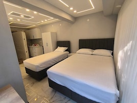 Luxury Room, Multiple Beds, Balcony, Garden View | Desk, laptop workspace