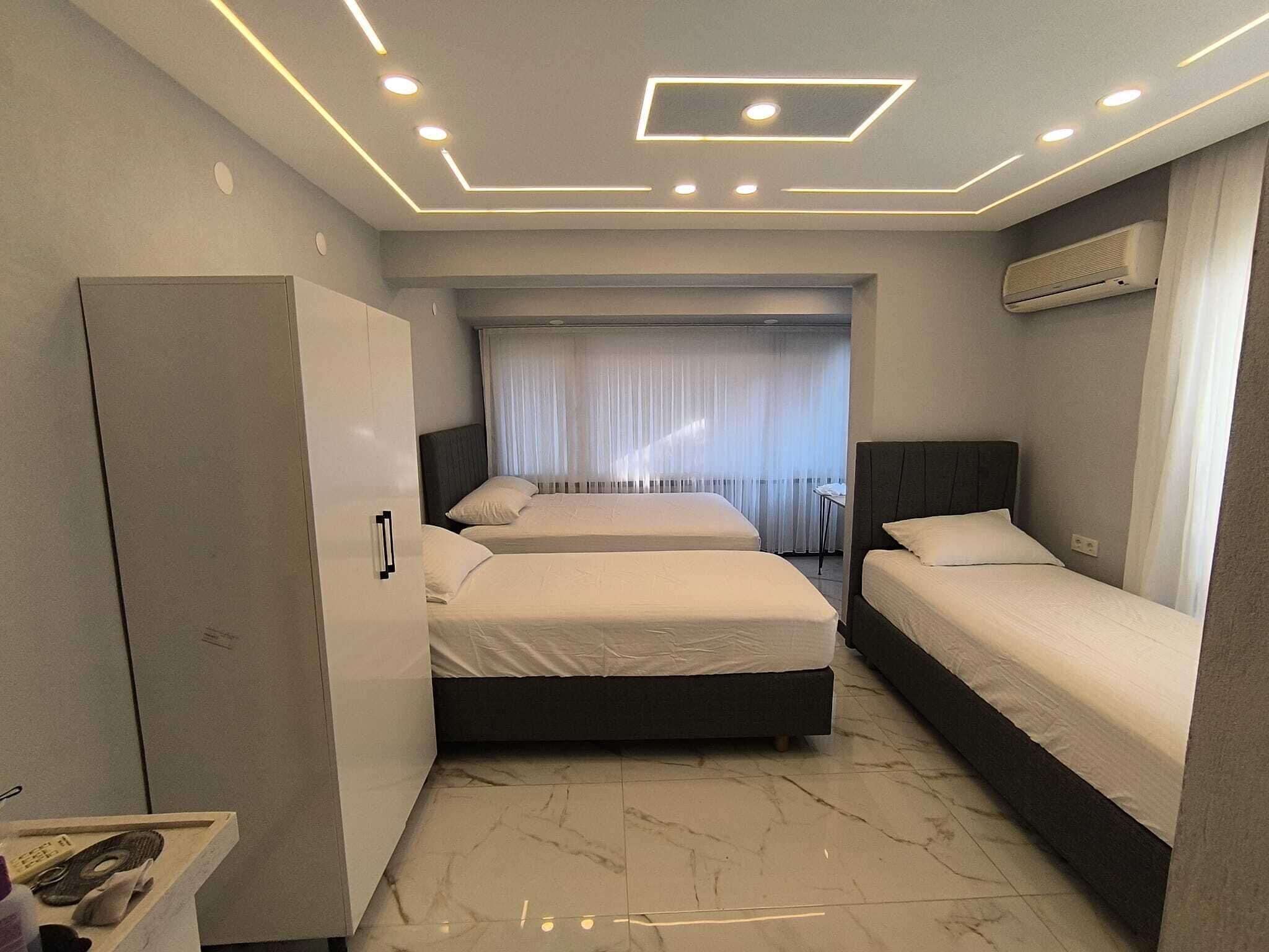 Chambre Luxe, plusieurs lits, balcon, vue jardin