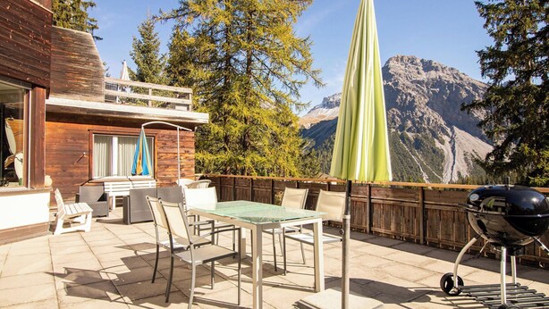 A patio with outdoor furniture, a grill, and a view of mountains. - Miraflor Betty by Arosa Holiday Appartement/Fewo, Dusche und Bad, WC, 8-Bettwohn by Interhome (Arosa)