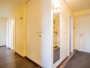 A hallway with white doors, wooden flooring, and a carpeted area. - Casa Linda 8 by Arosa Holiday Appartement/Fewo,  , 7-Bettwohnung Linda 8 by Interhome (Arosa)