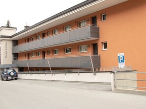 A multi-story building with balconies, a sign reading 'CASA LINDA,' and a blue parking sign. - Casa Linda 8 by Arosa Holiday Appartement/Fewo,  , 7-Bettwohnung Linda 8 by Interhome (Arosa)