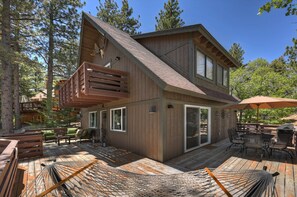 A wooden cabin with a deck, outdoor seating, and a hammock. - Natures Peak-family Retreat w/ 2 Fireplaces (Green Valley Lake)