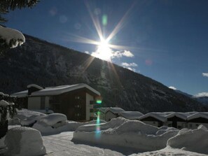 A snow-covered mountain with a building in the foreground. - Salve 3 # 4-bed apartment, Dusche, WC 4-Bettwohnung, Dusche, WC by Interhome (Leukerbad)