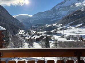 A mountain village with snow-covered buildings and a clear sky. - Edelweiss B 41 # 4-bed apartment, Dusche und Bad, WC by Interhome (Leukerbad)