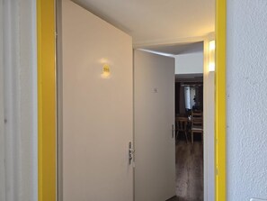 A hallway with a closed door marked with the number 316. - Fortuna 316 # 5-bed apartment, Dusche, WC 5-Bettwohnung, Dusche, WC by Interhome (Leukerbad)