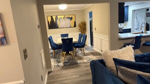 A modern kitchen with a white countertop and stainless steel appliances. - Bleu et Doré (Atlanta)