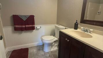 Shower, towels, soap, toilet paper