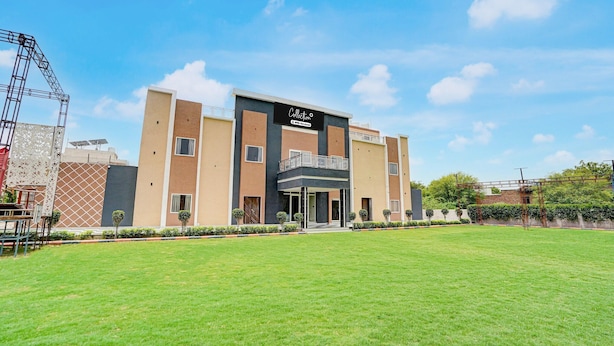 A modern building with a flat roof, a balcony, and a sign that reads 'Collection'. - Classic Ummed Palace (Mathura)