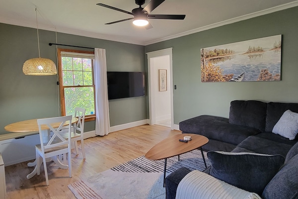 Cozy eat-in dining nook with bench seating — perfect for meals, games, or planning the day’s Duluth adventures.