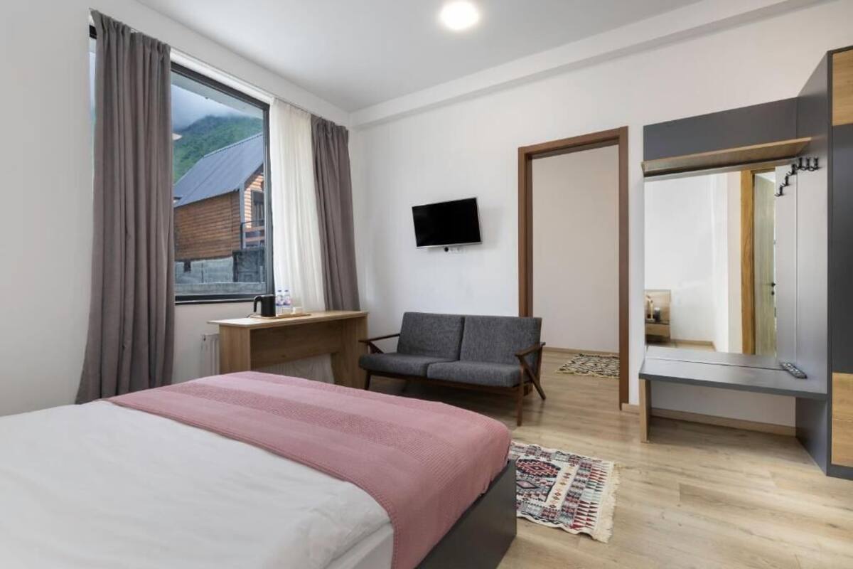 Junior Suite, Patio, City View | In-room safe, desk, soundproofing, iron/ironing board