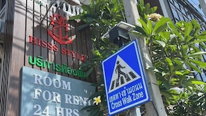 A hotel sign with a room for rent, a crosswalk zone sign, and a phone number. - HiSSS Style (Cha-am)