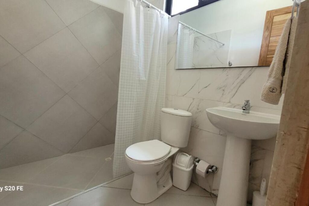 Shower, towels, soap, toilet paper