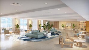 Eine geräumige Lobby mit Sitzgelegenheiten, großen Fenstern und Zimmerpflanzen.