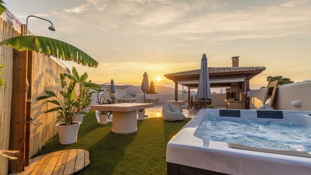 A rooftop patio with a hot tub, outdoor seating, and potted plants. - Enclave Luxury Apartments Zante Experience equiped with Jacuzzi,BBQ,GYM (Zakinthos)