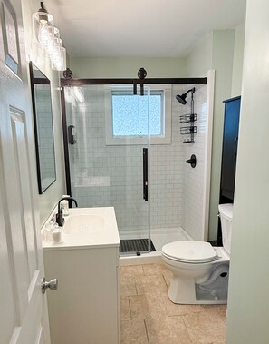 Shower, hair dryer, towels, soap