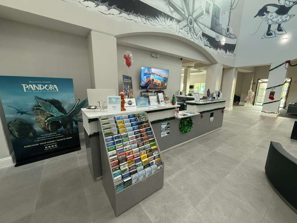 A lobby area with a reception desk, a poster for 'Pandora: The World of Avatar', and a display of magazines.