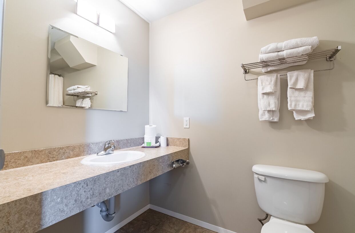 Separate tub and shower, towels, soap, shampoo