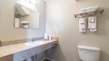 Separate tub and shower, towels, soap, shampoo