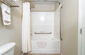 Separate tub and shower, towels, soap, shampoo