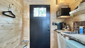 Fridge, microwave, coffee/tea maker, cookware/dishes/utensils