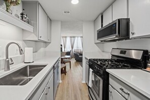 Coffee/tea maker, fridge, microwave, oven - Stay on Lavaca | Walk to Capitol, UT, Moody Center & Live Music | Garage Parking (Austin)