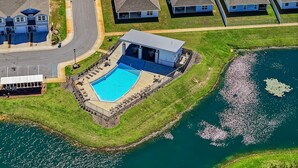A residential area with a swimming pool, houses, and a road. - Coastal Retreat / Near 30A / Pool / 4BR / Sleeps 10 (Santa Rosa Beach)