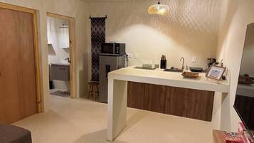 Fridge, microwave, stovetop, coffee/tea maker