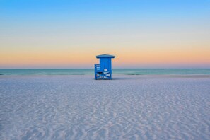 A lifeguard tower on a beach with a clear sky. - NEWLY LISTED: 3 bed & 3 bath condo just steps away from private Siesta Key beach (Sarasota)