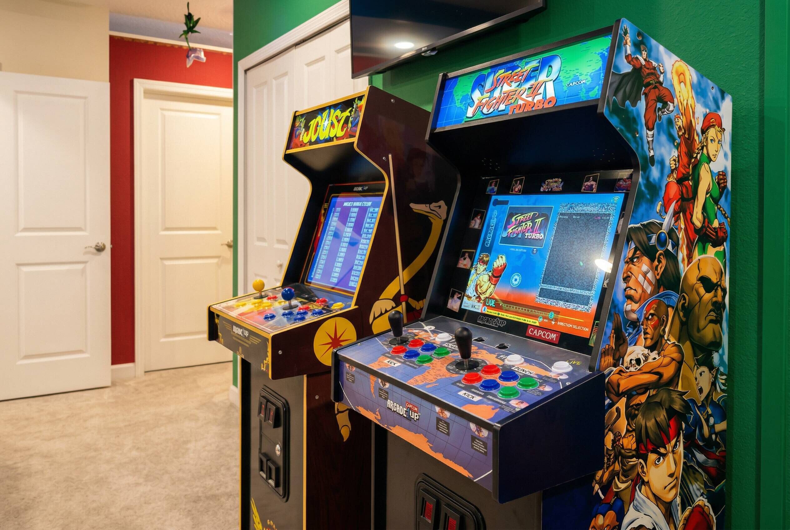 Arcade machines with colorful graphics and game titles.