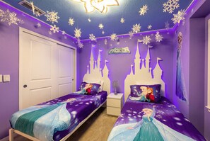 A bedroom with two beds, a nightstand, and a wall with a Frozen-themed mural. - Last Minute Disney! Private Pool, Game Room & Themed Bedrooms. Book Now! #170359 (Orlando)