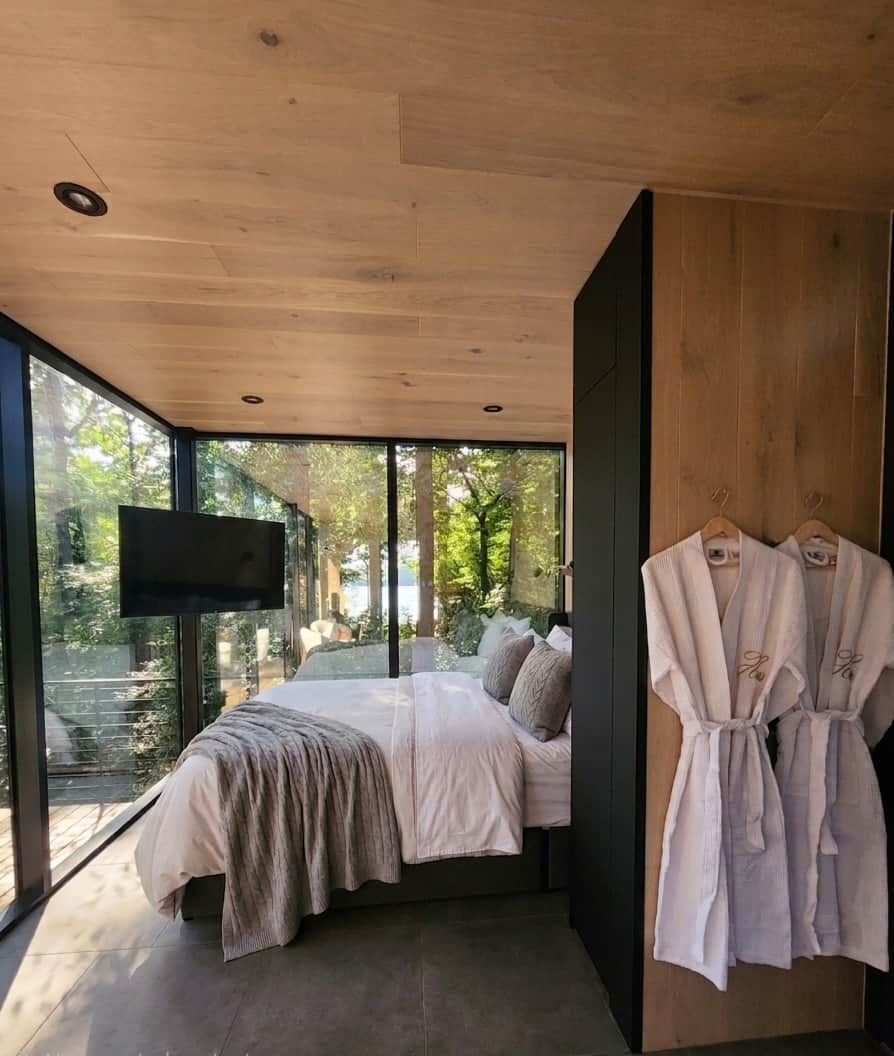 Wake up surrounded by trees, with the lake just steps away