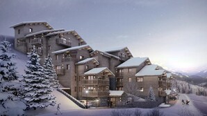 A multi-story hotel with balconies, snow-covered roofs, and a mountainous backdrop. - Chalet Ouréa #102 - 6 guests - Ski-in - Ski-out (Les Allues)