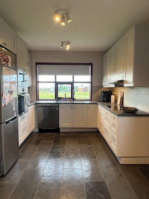 Coffee/tea maker, fridge, microwave, oven