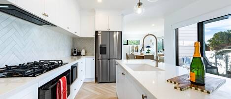 Coffee/tea maker, fridge, microwave, oven