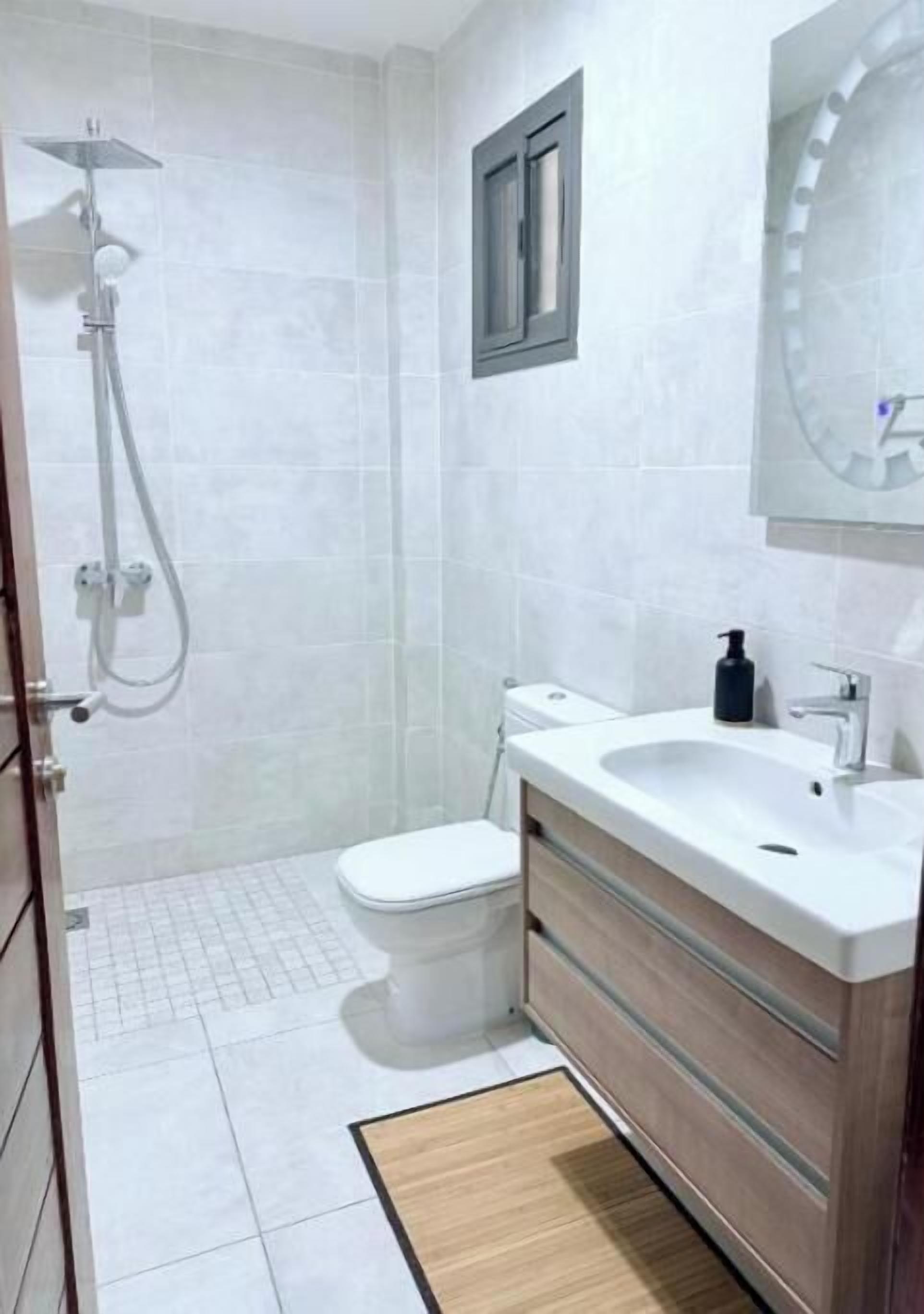 Shower, hair dryer, towels, toilet paper